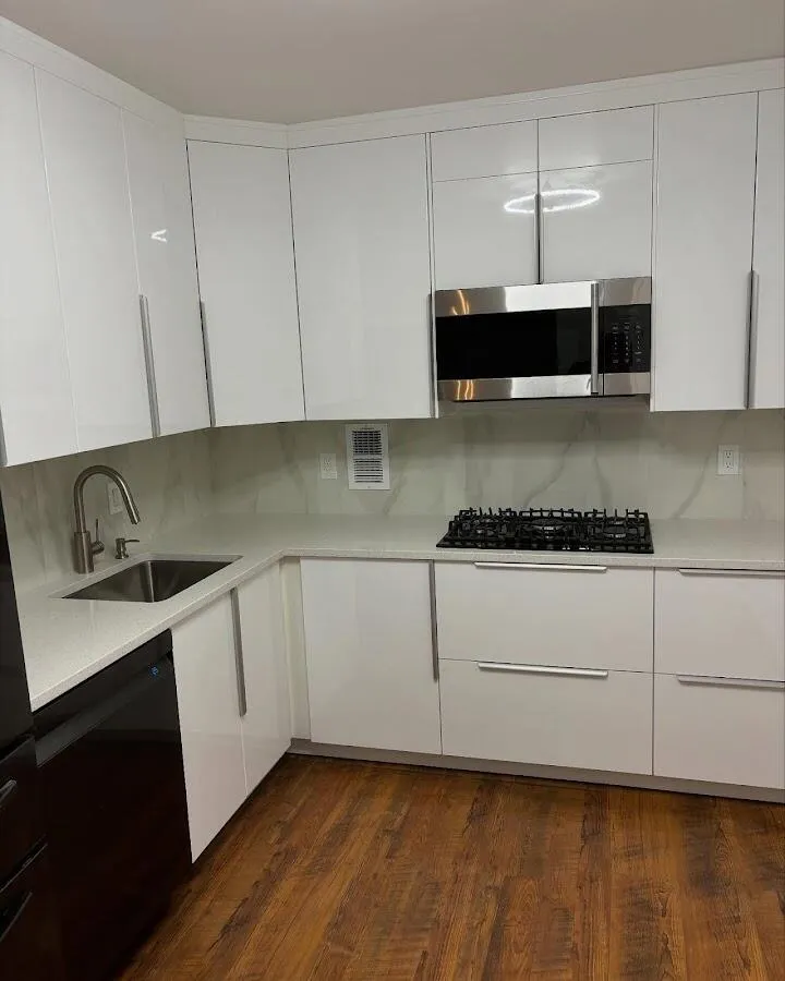 Restored kitchen with white cabinets after water damage in Woodside